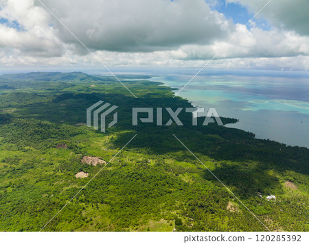Top view of island with jungle and blue sea. Seascape in the tropics. Balabac, Palawan. Philippines. Top view of island with jungle and blue sea. Seascape in the tropics. Balabac, Palawan. Philippines. 120285392