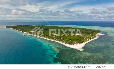 Aerial view of island with beautiful beach, palm trees by turquoise water view from above. Patongong Island with sandy beach. Balabac, Palawan. Philippines. Aerial view of island with beautiful beach, palm trees by turquoise water view from above. Patongong Island with sandy beach. Balabac, Palawan. Philippines. 120285408