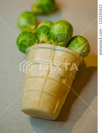 Creative Brussels Sprouts in ice cream Waffle Cone. Unique Healthy Food Concept. High quality photo 120285822