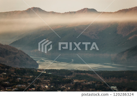 Lake Ashi at dawn with smoke rising from Mt. Kintoki in Hakone 120286324