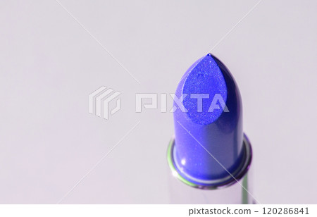 Close-up of a blue lipstick on a white background, top view 120286841
