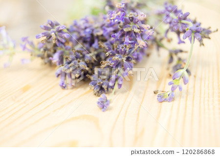 Bouquet of lavender flowers in Provence style on a wooden background, selective focus Bouquet of lavender flowers in Provence style on a wooden background, selective focus 120286868
