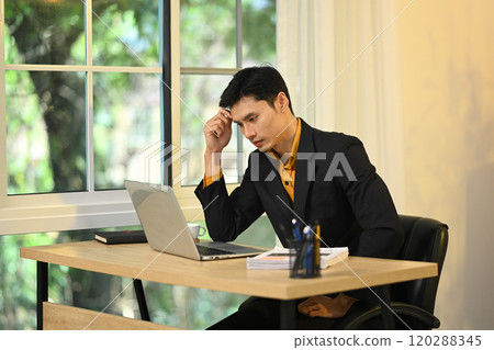 Serious businessman contemplating solutions to business problems 120288345