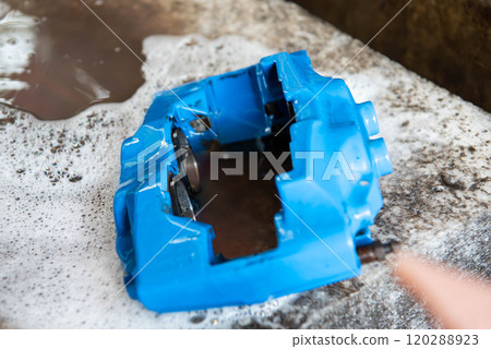Checking car brake system for repair at car garage Checking car brake system for repair at car garage 120288923