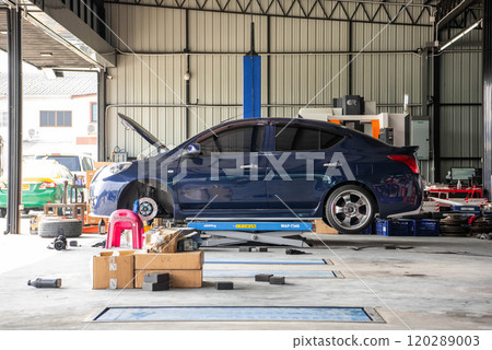 Checking car brake system for repair at car garage Checking car brake system for repair at car garage 120289003