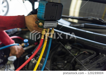 Car refilling air condition at car garage Car refilling air condition at car garage 120289004