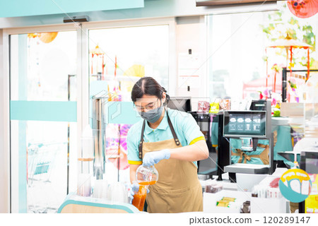 Asian woman barista pouring latte in coffee shop Asian woman barista pouring latte in coffee shop 120289147