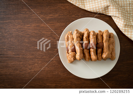 chocolate meringue stick on plate chocolate meringue stick on plate 120289255