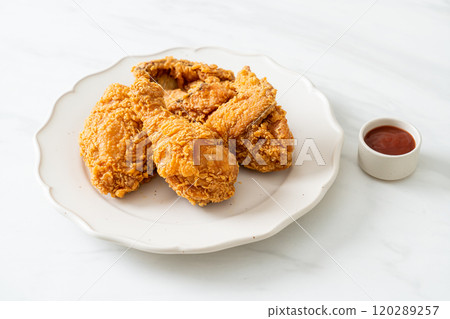 fried chicken with ketchup on plate fried chicken with ketchup on plate 120289257