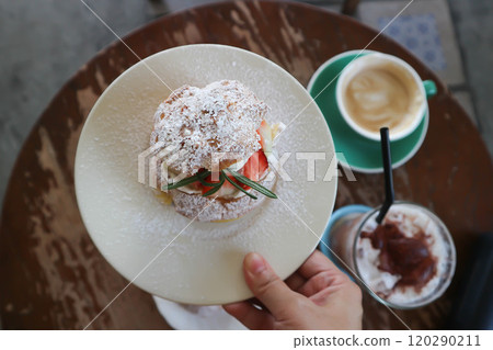 choux cream or cream puff, eclair or strawberry choux cream 120290211