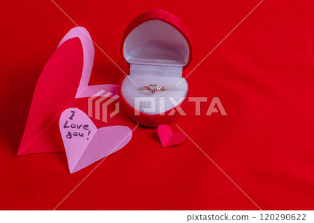 concept of a love proposal with a cone cut out hearts and the phrase I love you concept of a love proposal with a cone cut out hearts and the phrase I love you 120290622