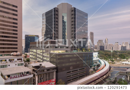 BTS Sky railway tracks and Intersection bridge pass through in downtown with traffic on the street below in central business district. 120291473