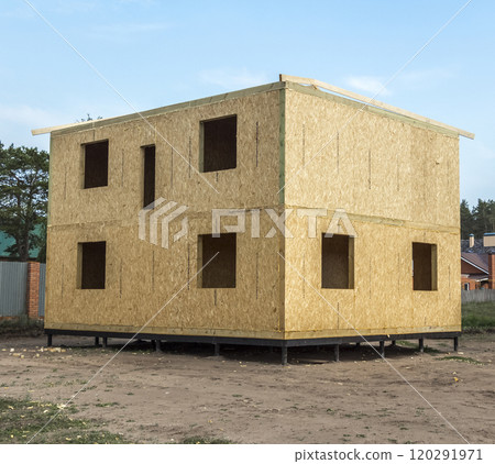 Construction of a wooden house 120291971