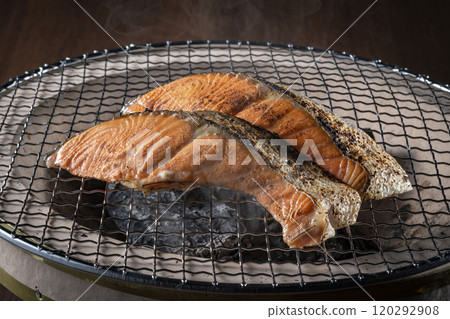 Delicious salmon grilled on a charcoal grill 120292908