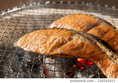 Delicious salmon grilled on a charcoal grill 120292913