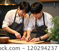 Same-sex couple cooking 120294237