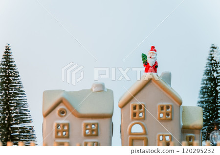 Winter miniature scene - Santa and house in snow Winter miniature scene - Santa and house in snow 120295232