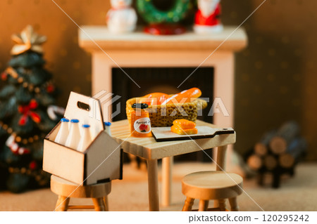 Christmas miniature scene with fireplace - dining items on table Christmas miniature scene with fireplace - dining items on table 120295242