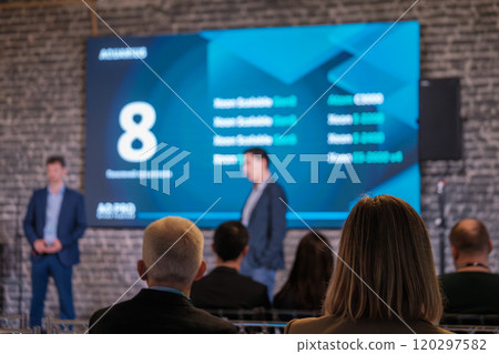 Business presentation with digital screen in modern setting 120297582