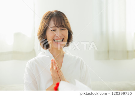 Parents and children giving Mother's Day presents Parents and children giving Mother's Day presents 120299730