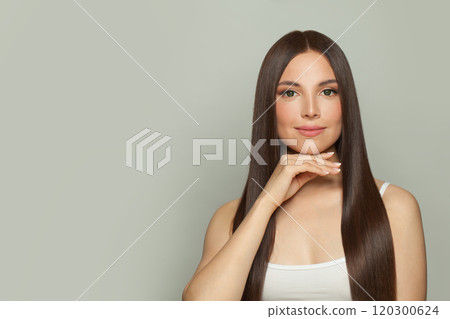 Elegance young woman model with natural make-up and long straight brown hair portrait. 120300624