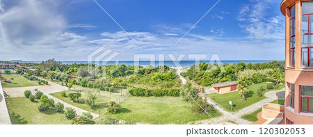 Panoramic view of Livorno beach in summer from the land side with greenery and sea in the background 120302053