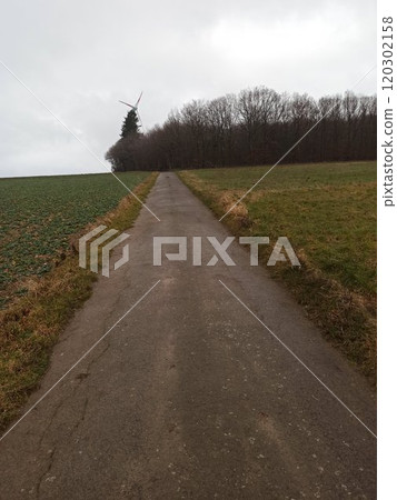 Drone perspective of rural road and railroad line in the countryside, aerial view in Germany Drone perspective of rural road and railroad line in the countryside, aerial view in Germany 120302158