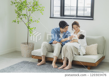 Young family, parents and children, living room 120303476