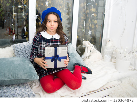 Christmas is just for children. Small girl enjoy Saint Nicholas Day. Small child got xmas present. Small kid celebrate Christmas and new year. Merry Christmas. Happy New Year. Boxing day 120304872