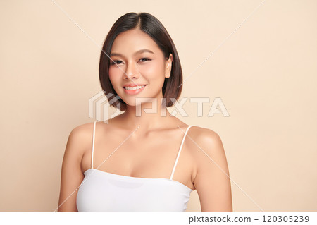 Beautiful young asian woman with clean fresh skin on beige background, Face care, Facial treatment, Cosmetology, beauty and spa, Asian women portrait. Beautiful young asian woman with clean fresh skin on beige background, Face care, Facial treatment, Cosmetology, beauty and spa, Asian women portrait. 120305239