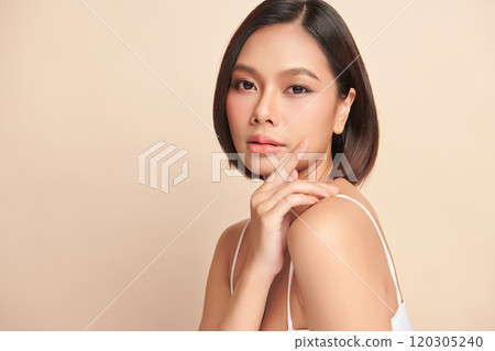 Beautiful young asian woman with clean fresh skin on beige background, Face care, Facial treatment, Cosmetology, beauty and spa, Asian women portrait. 120305240