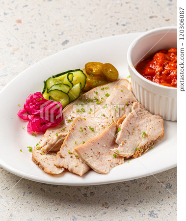 Portion of chicken brisket with beans and pickles Portion of chicken brisket with beans and pickles 120306087