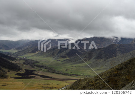 Chike-Taman pass in Altai mountains. Mountain landscape in the Altai Republic, Autumn mountains with green and yellow trees. Autumn landscape Chike-Taman pass in Altai mountains. Mountain landscape in the Altai Republic, Autumn mountains with green and yellow trees. Autumn landscape 120306742