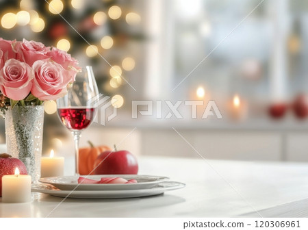 Romantic setting with roses, candles, and wine glasses for a cozy evening celebration 120306961