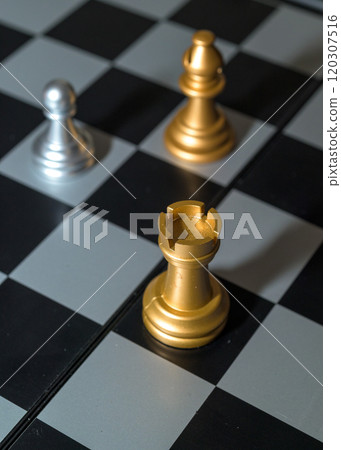 Chessboard with close up of chess game pieces 120307516