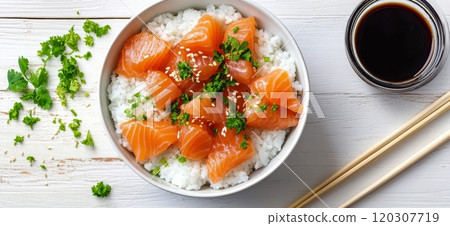 Fresh salmon sushi served on a bowl of rice with ginger and soy sauce Fresh salmon sushi served on a bowl of rice with ginger and soy sauce 120307719