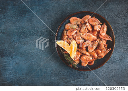 fried shrimp, with shell and head, unpeeled, size 70-90, on a blue background, homemade, no people, 120309353