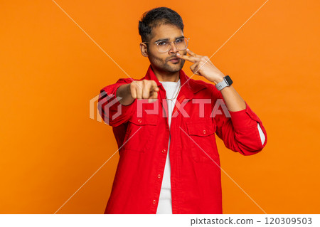 Man pointing at his eyes and camera show I am watching you gesture spying watching on someone Man pointing at his eyes and camera show I am watching you gesture spying watching on someone 120309503