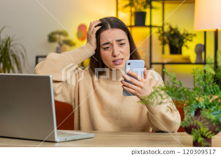 Sad pretty woman use smartphone surprised by bad news, fortune loss, fail, lottery results, deadline 120309517