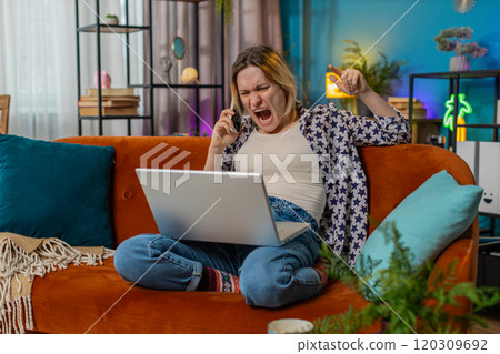 Furious annoyed young woman freelancer engage in heated phone conversations quarrel frustration Furious annoyed young woman freelancer engage in heated phone conversations quarrel frustration 120309692