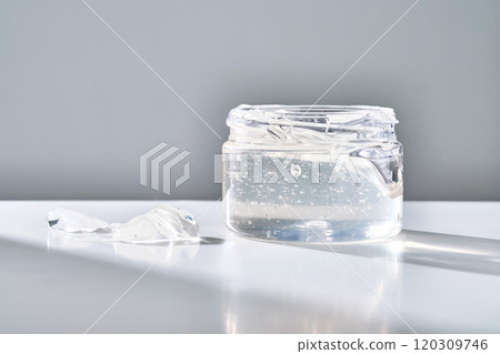 Texture of the gel in the jar. Hair gel or hyaluronic gel for the face. Texture of the gel in the jar. Hair gel or hyaluronic gel for the face. 120309746