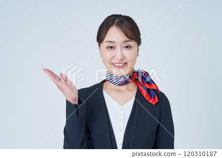 A woman in a suit posing as a guide 120310187