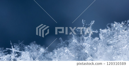 winter photo of snowflakes in the snow 120310389