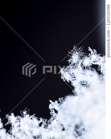 winter photo of snowflakes in the snow 120310398