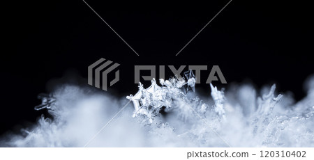 winter photo of snowflakes in the snow 120310402