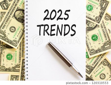 Planning 2025 trends new year symbol. Concept words 2025 Trends on beautiful white note. Beautiful background from dollar bills. Black pen. Business 2025 trends new year concept. Copy space. Planning 2025 trends new year symbol. Concept words 2025 Trends on beautiful white note. Beautiful background from dollar bills. Black pen. Business 2025 trends new year concept. Copy space. 120310553
