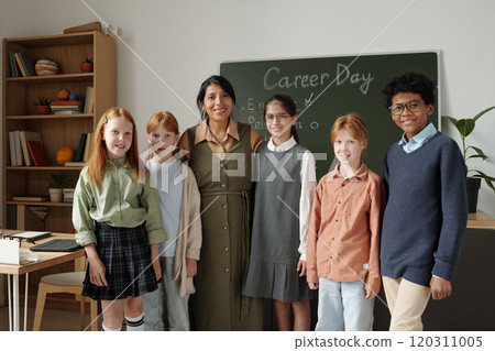 Happy teacher and schoolchildren Happy teacher and schoolchildren 120311005
