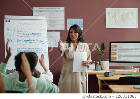 Teacher communicating with schoolkids 120311065