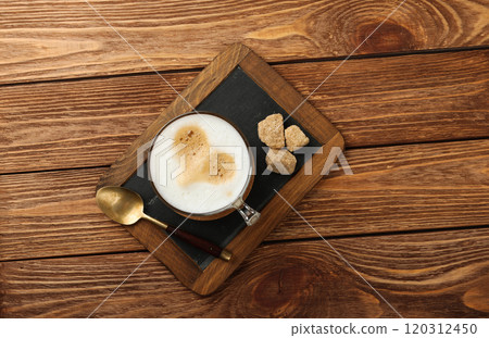 Cappuccino coffee cup on slate serving board 120312450