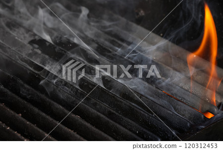 Cast iron metal grill grate with fire and smoke Cast iron metal grill grate with fire and smoke 120312453